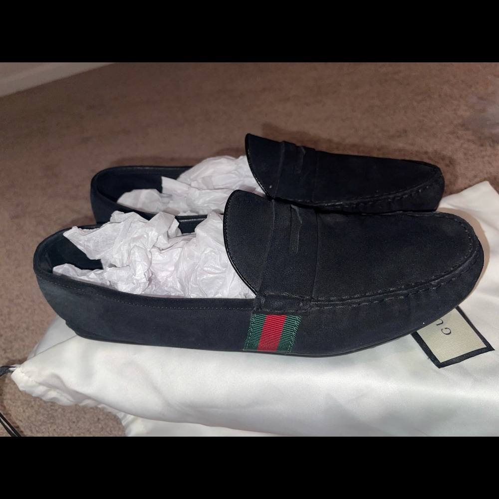 Black Gucci loafers with red and green stripe on side